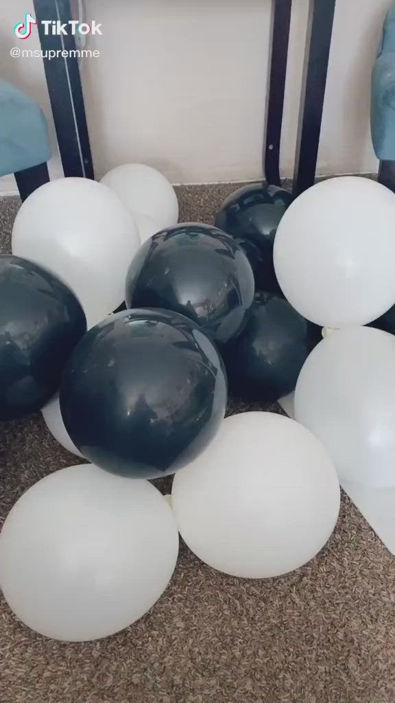 This may contain: balloons are stacked on top of each other in the shape of a star and number