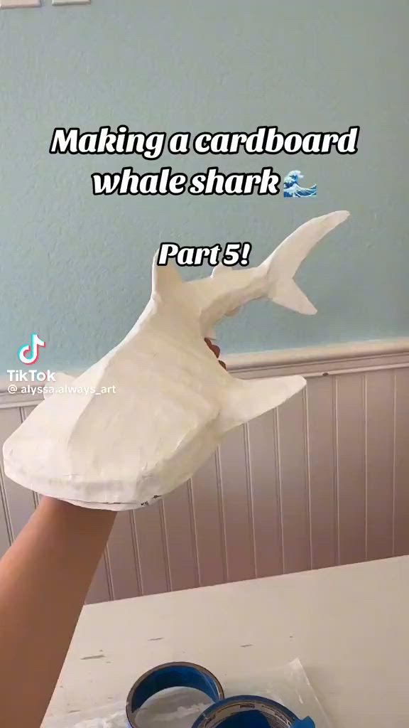 This may contain: someone is making a cardboard whale shark part 5