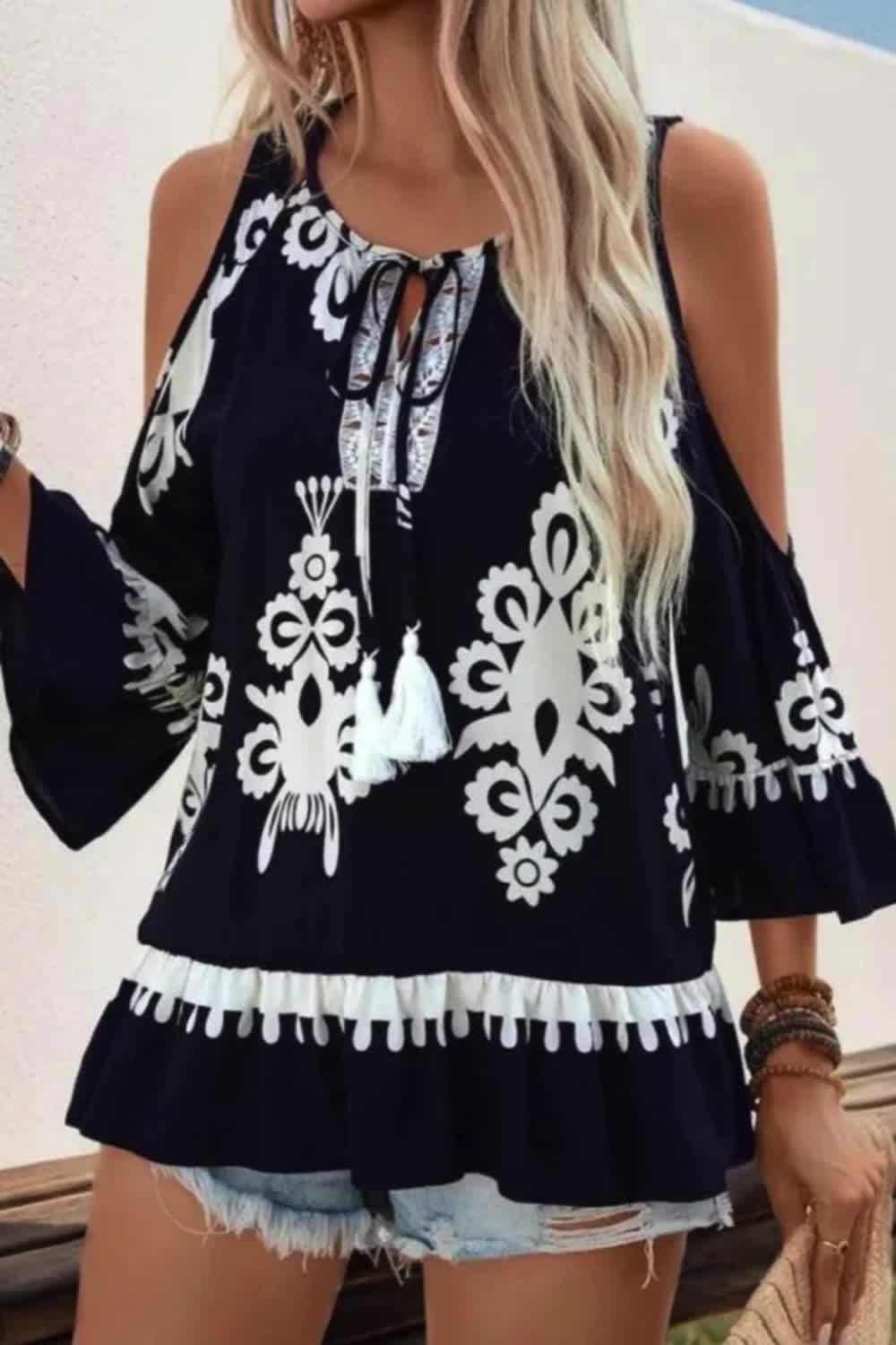 This retro-inspired shirt blends fashion and comfort with its cold shoulder design and lace-up details. The lace-up front and tassel accents add a playful touch, while the relaxed fit ensures ease of wear. Perfect for casual outings, this shirt combines vintage charm with modern style.