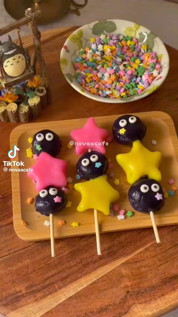 This may contain: there are some cake pops that have eyes and stars on them