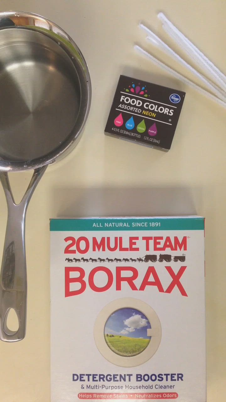 This may contain: the ingredients to make borax are laid out on a white table with spoons