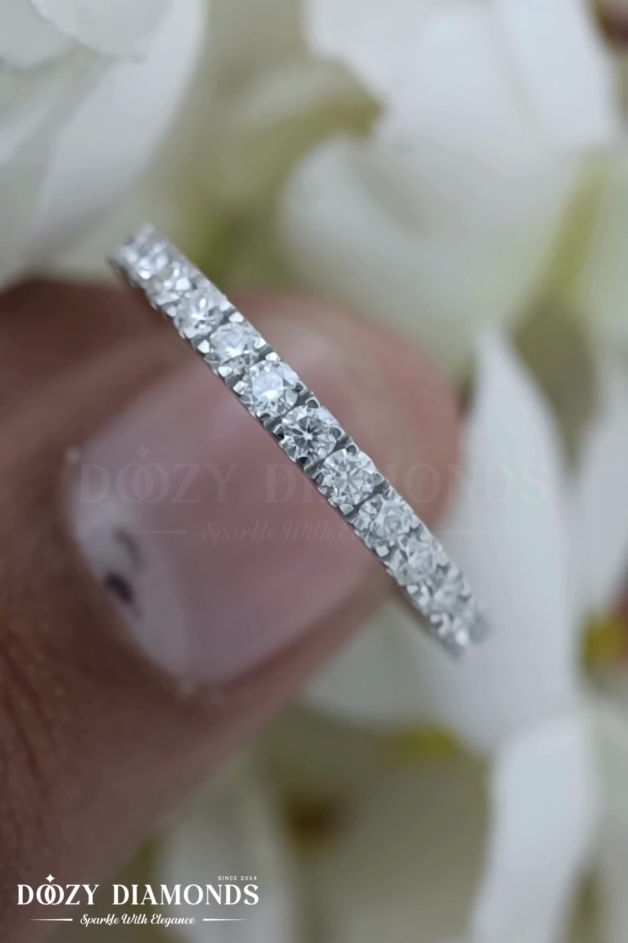 This contains: ROUND FG-VS2 LAB GROWN DIAMOND FRENCH CLAW HALF ETERNITY BAND