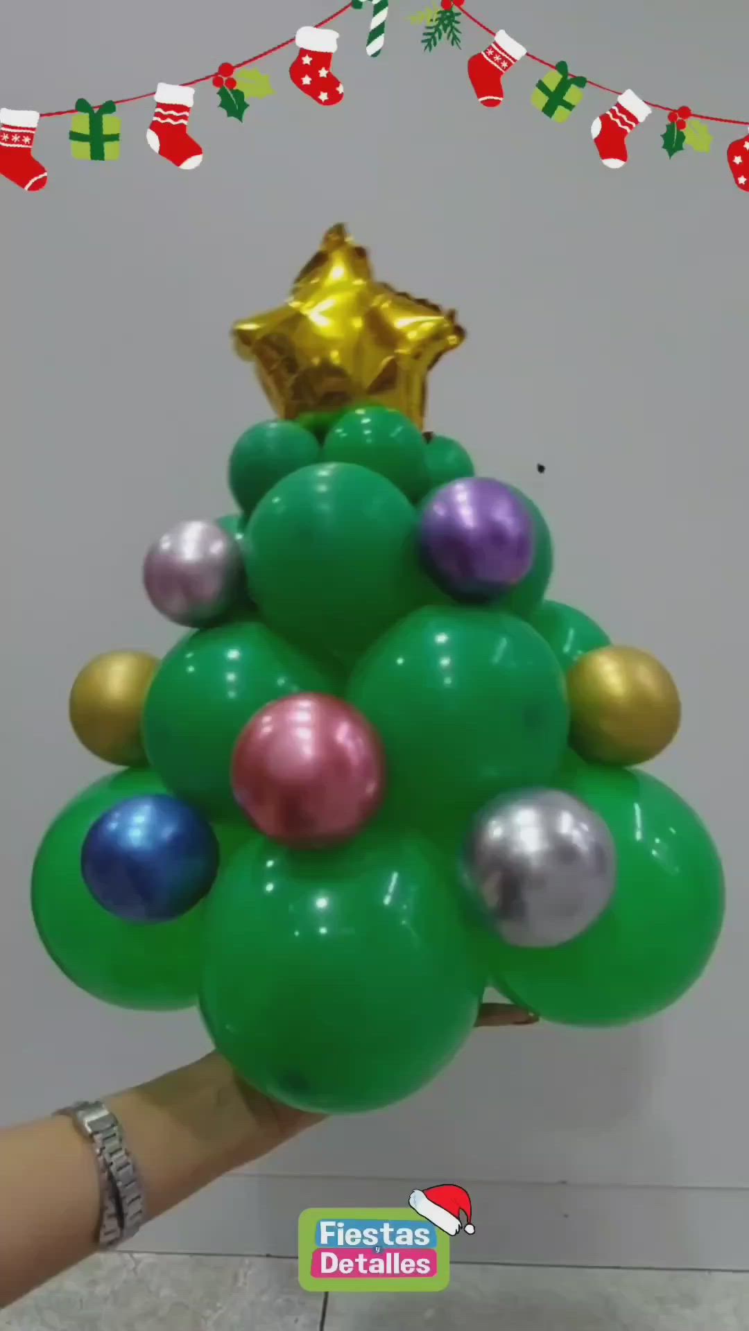 This may contain: a christmas tree made out of balloons