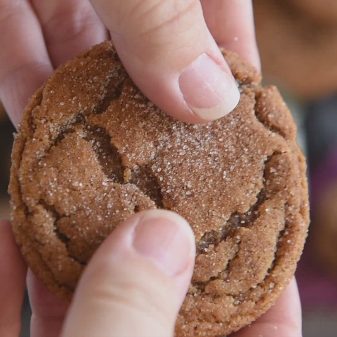 This may contain: a pile of cookies sitting on top of a black plate