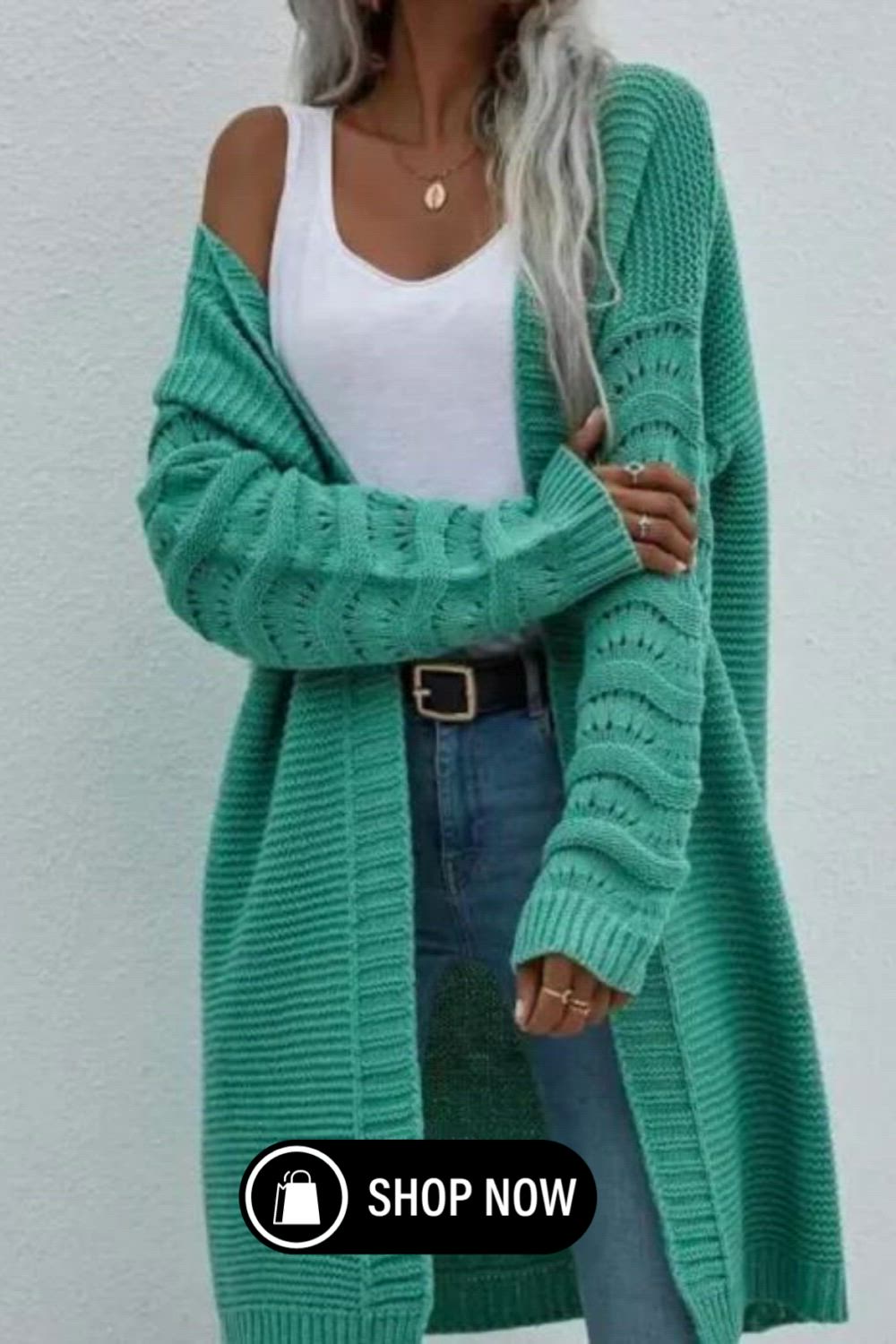 This women's cardigan is a fashionable wardrobe staple. Crafted in a solid color, it exudes versatility and style. The loose, knitted design offers both comfort and a chic look, making it a perfect choice for any season. Elevate your fashion game with this trendy sweater.