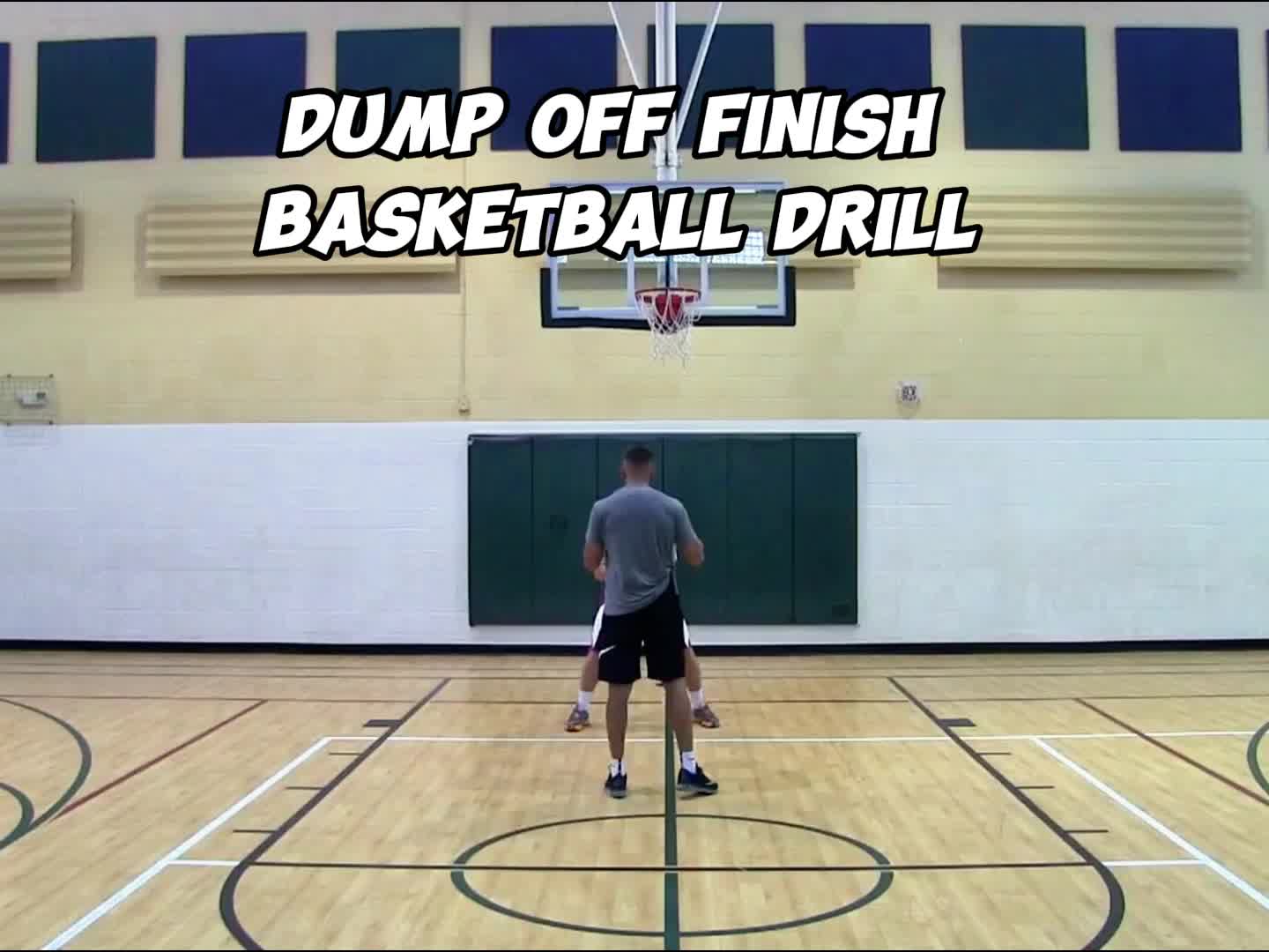 This may contain: two men are playing basketball on an indoor court with the words jump off finish basketball drill