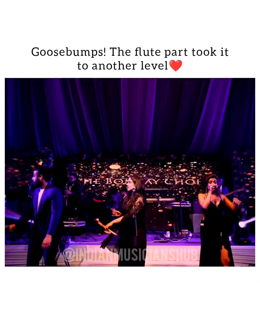 This may contain: two women singing on stage in front of a microphone with the words gosebumps the flute part took it to another level