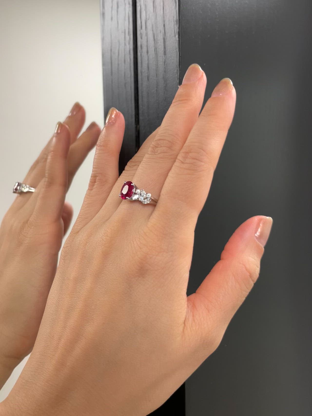 A unique engagement ring set with a vivid red pogeon blood ruby and marquise diamonds.