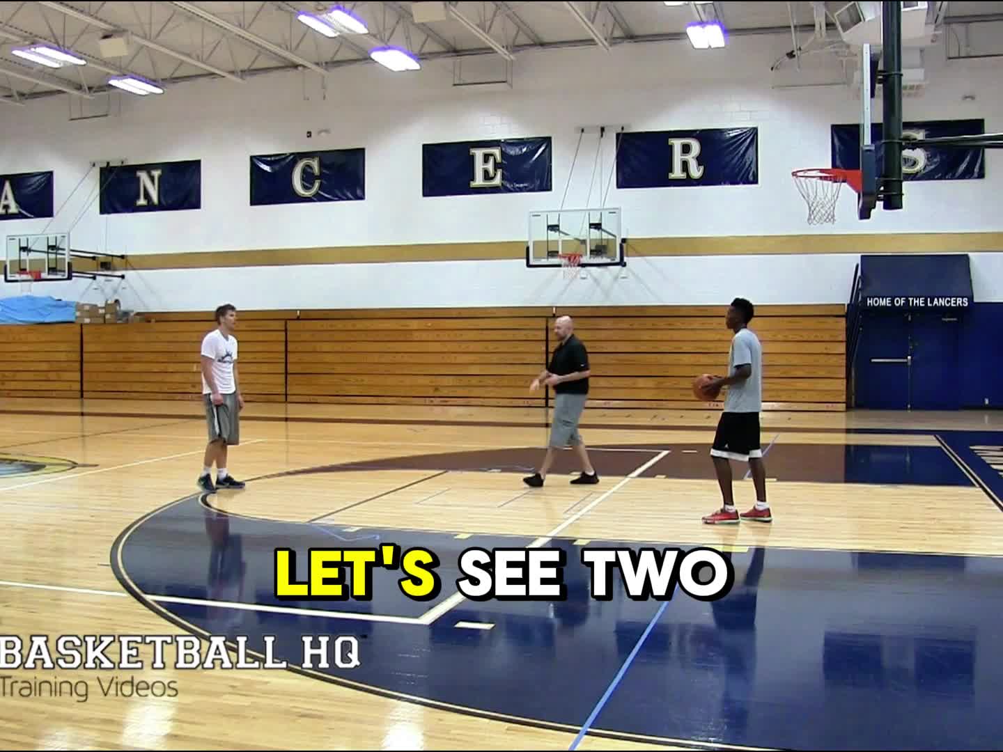 This may contain: three young men playing basketball in an indoor gym with the words more above them that read,