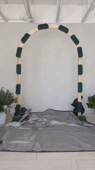 This contains: creation of an ombre wedding arch