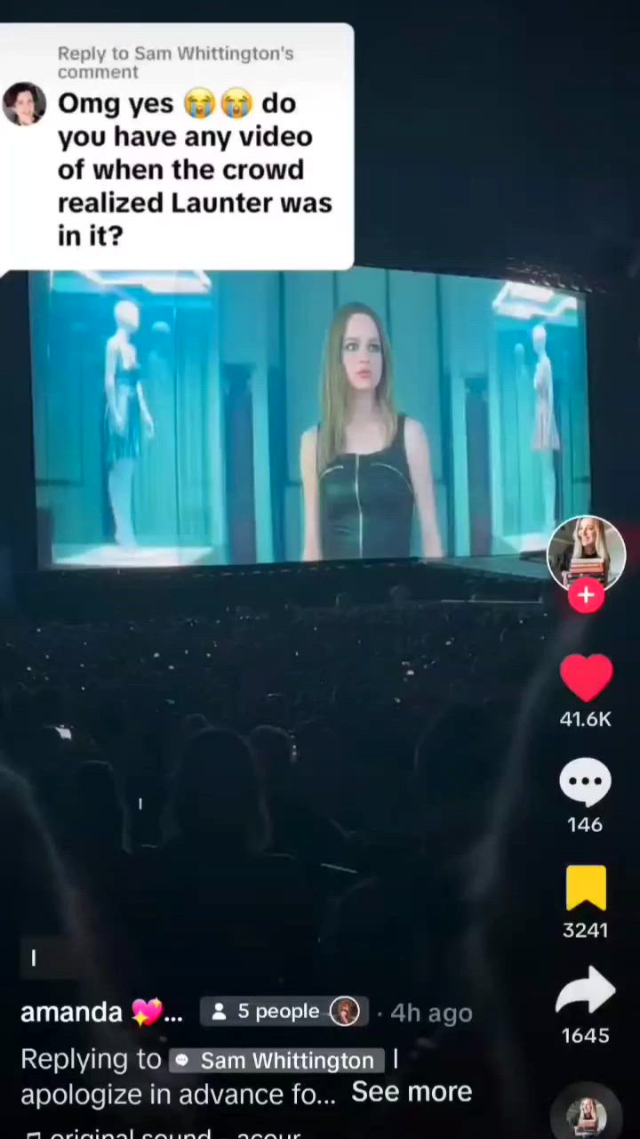 This may contain: the screen is showing an image of a woman with long hair and wearing a black dress