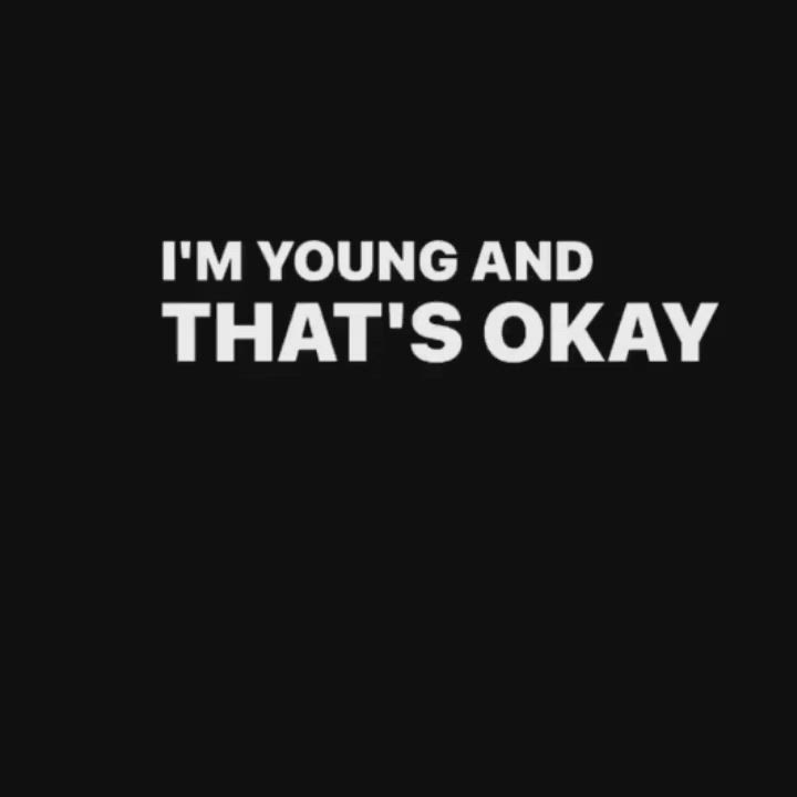 This may contain: the words i'm young and that's okay in white on a black background