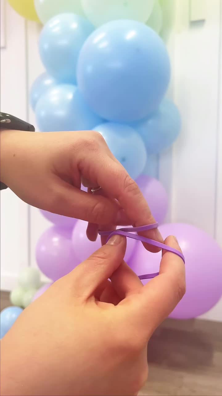 This may contain: someone is trying to tie the string with balloons in the background that says, did you know this trick?