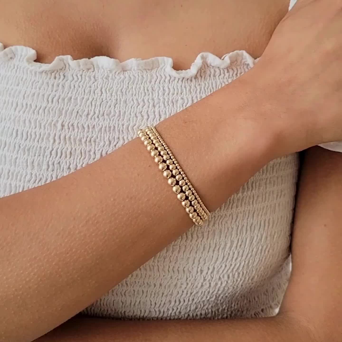 Our Stretch Bead Bracelet is the perfect balance between simple and bold. This bracelet is so versatile, so you can wear it casually lounging at home or dress it up and wear it to a fancy dinner party! Since it's a stretch bracelet, it's so comfortable that you'll never want to take it off (and you won't have to!). DETAILS 14k gold filled -or- sterling silver beads Bracelet length: 6.5". Please measure your wrist to see if this will fit, as we only have one size. It can stretch up to 6.75" comfo