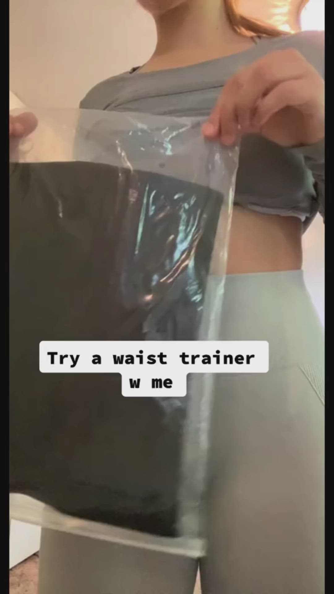 This may contain: a woman holding up a plastic bag with the words try a waist trainer we me