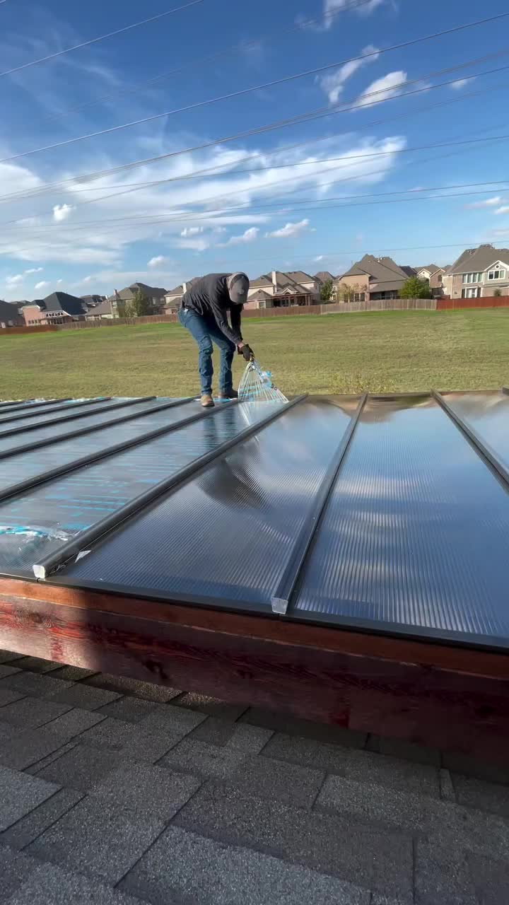 This may contain: a man working on the roof of a house