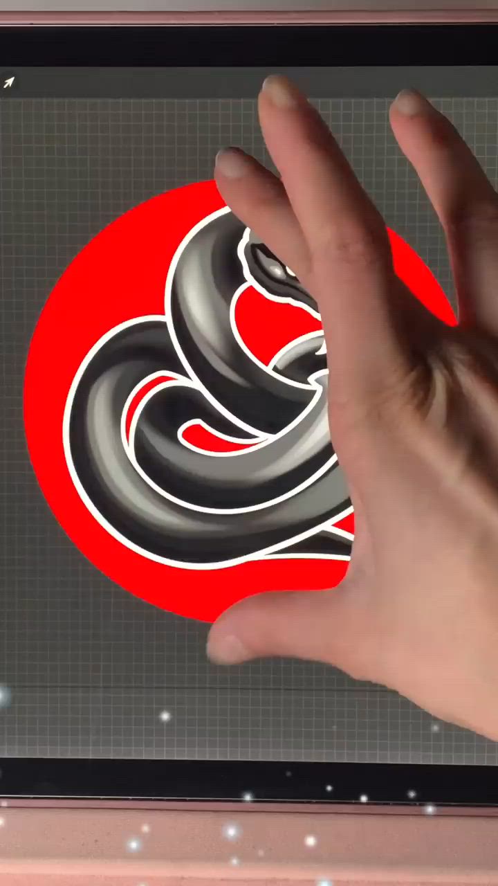 This may contain: a person's hand is touching the screen of a tablet with an image of a snake on it