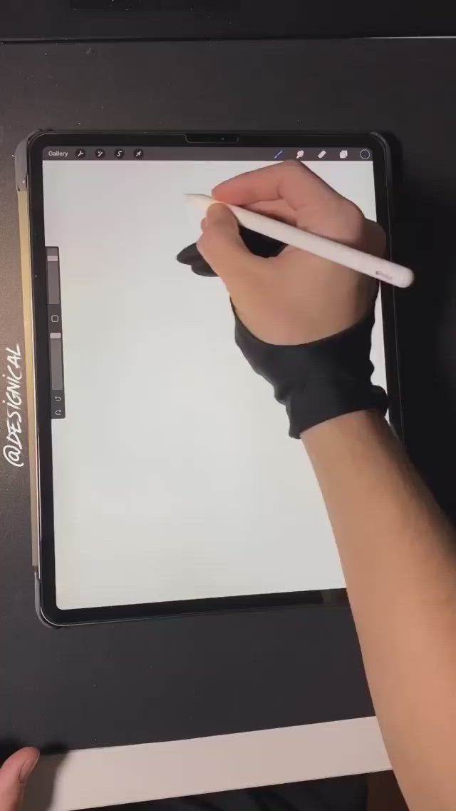 This may contain: a person is drawing on an ipad with a white pen and black eraser in their hand