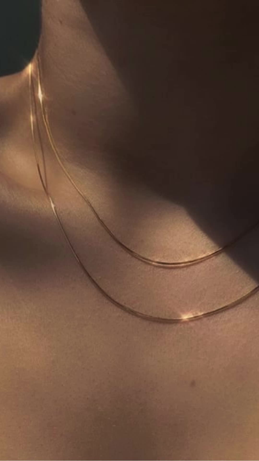 This silky Ultra Thin Snake Chain Necklace is giving us sexy vibes and we're totally unapologetic about it! This necklace can be layered up for a maximalist look, or worn alone it looks impeccable as it drapes over your collarbone.  >> Ultra Thin Gold Snake Chain Necklace: https://pinealvisionjewelry.com/products/ultra-thin-snake-chain-necklace