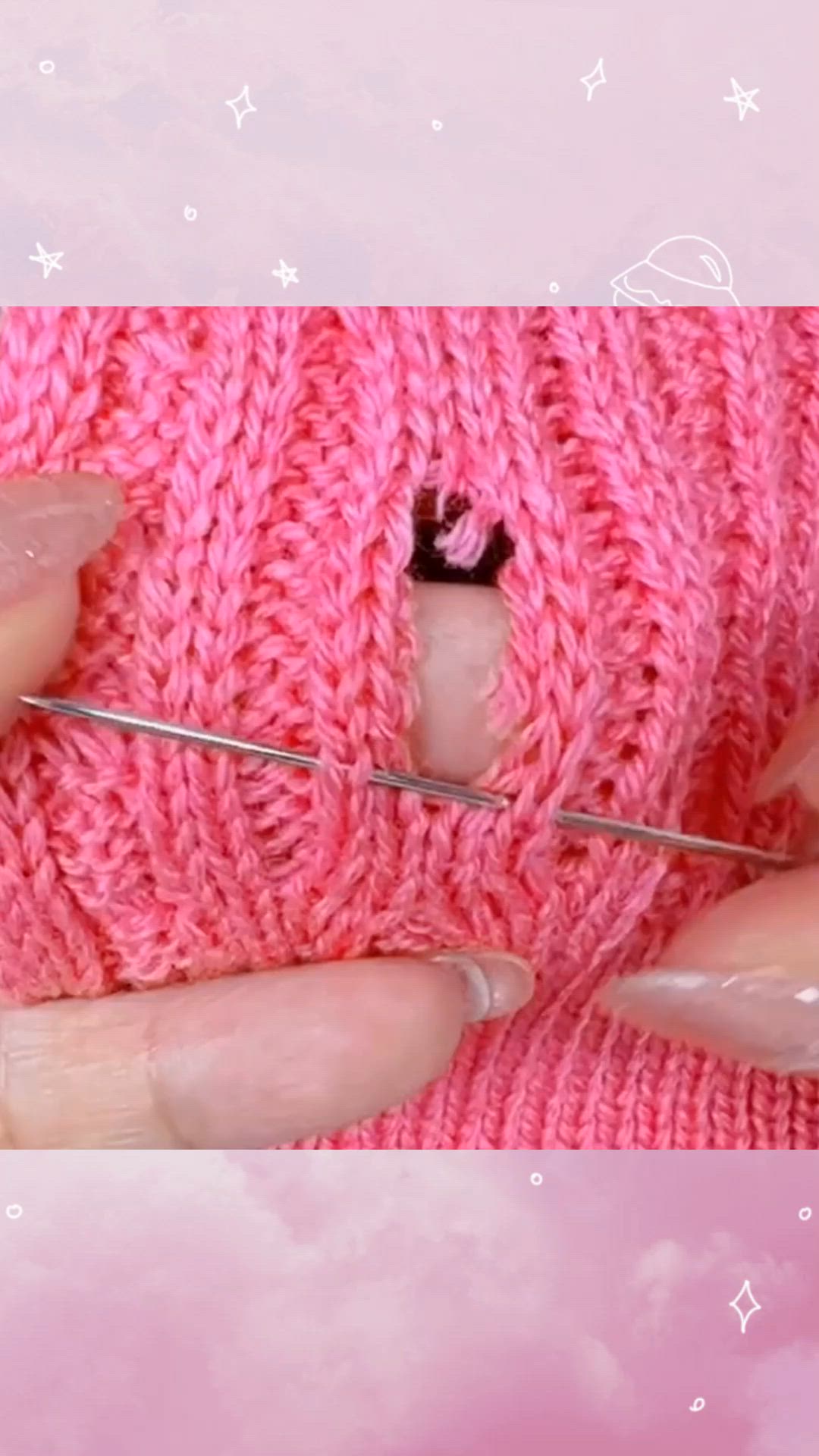 This may contain: a woman is knitting with her fingers and needle in the middle of knitted pink sweater