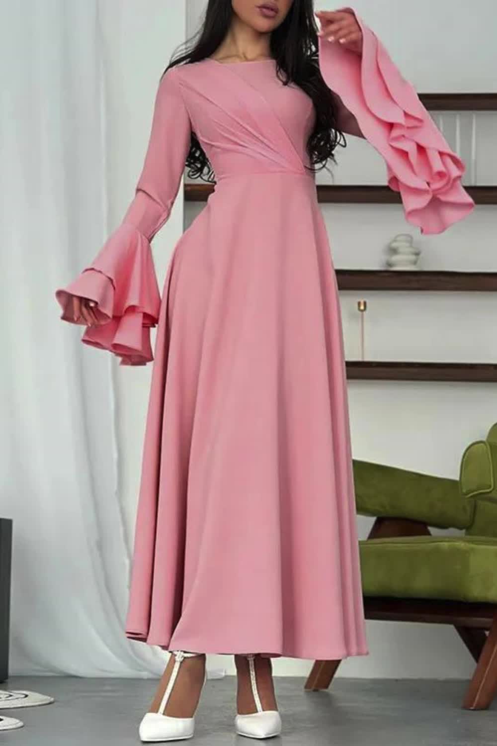 "Elegant and feminine, this A-line midi dress features flared sleeves and delicate pleats. Designed with a round neck and a solid color, it exudes timeless charm and effortless style."