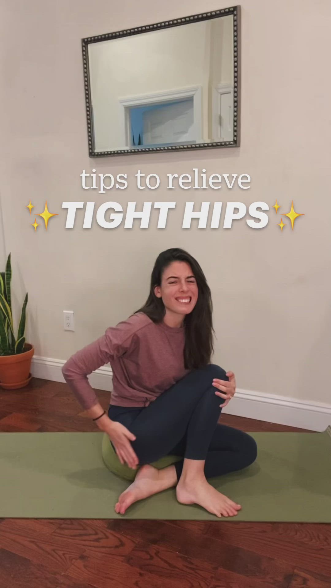 This may contain: a woman sitting on top of a yoga mat with the words tips to believe tight hips