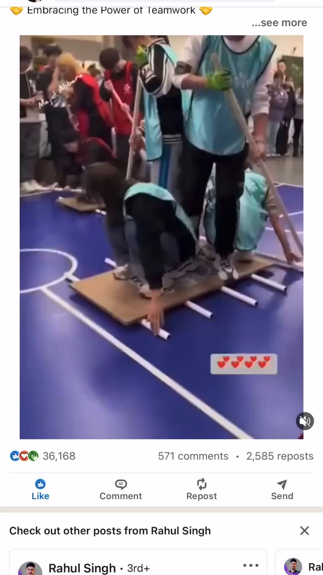 This may contain: an image of people standing on top of a wooden board in front of a crowd