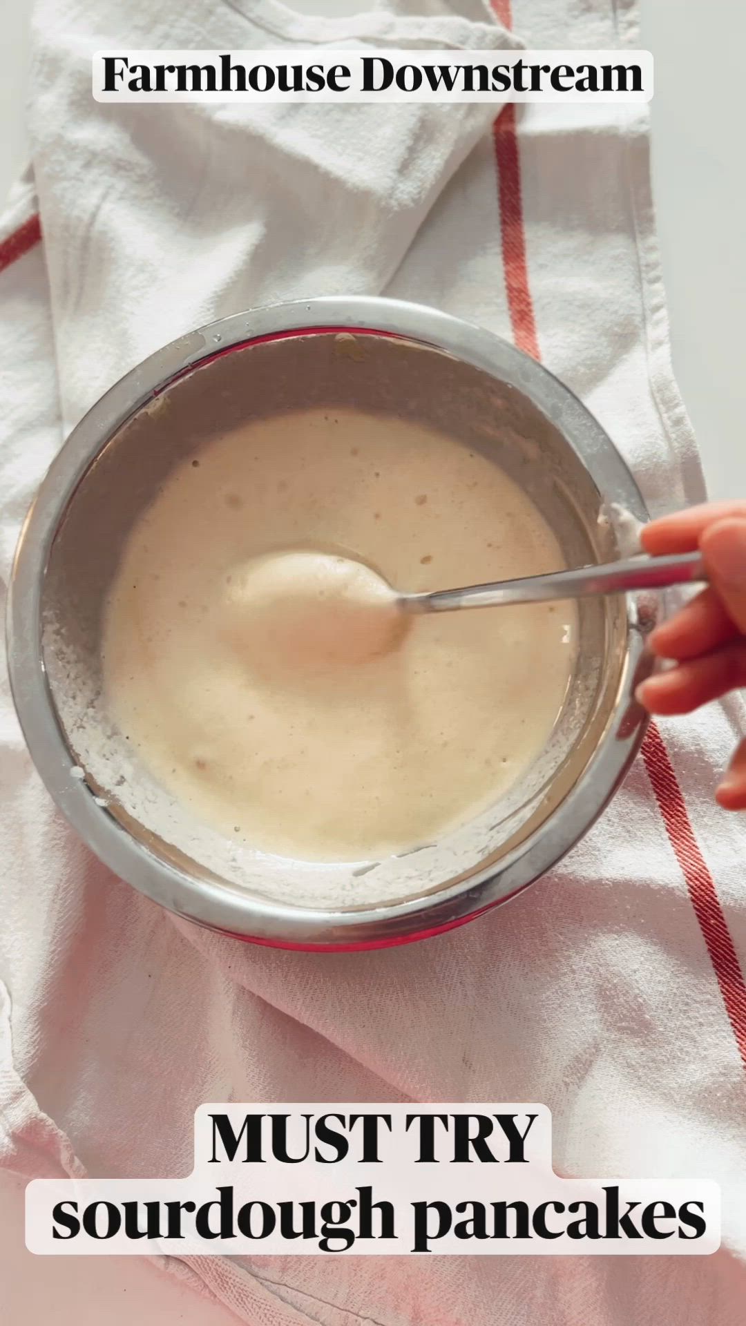 This may contain: a person is mixing something in a bowl with a spoon on top of a towel