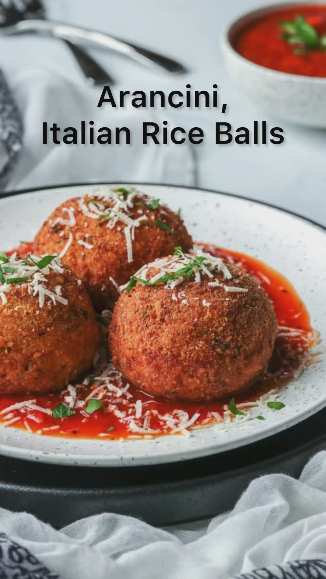 This may contain: three italian rice balls on a white plate