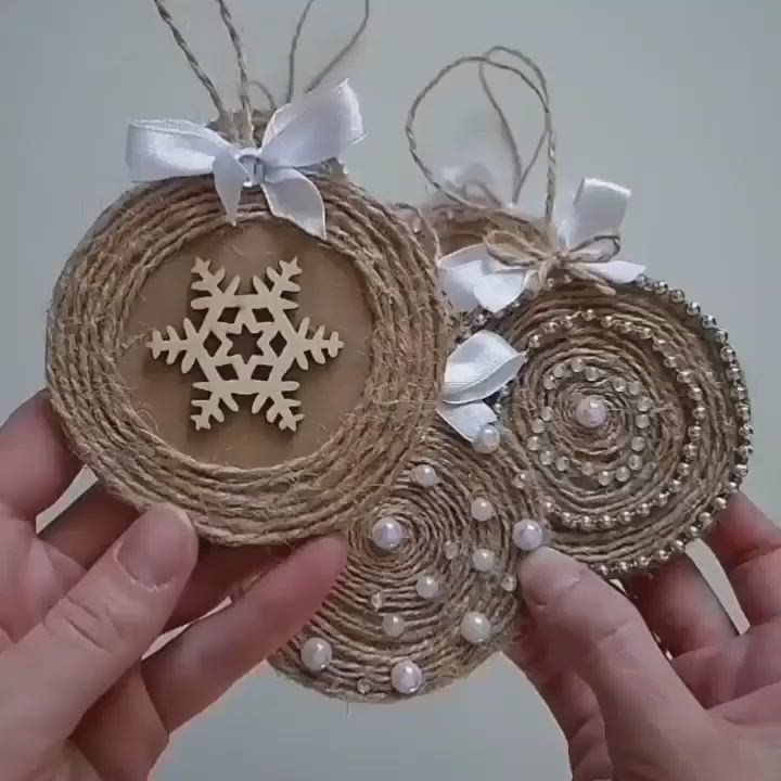 This may contain: two handmade ornaments are being held in their hands