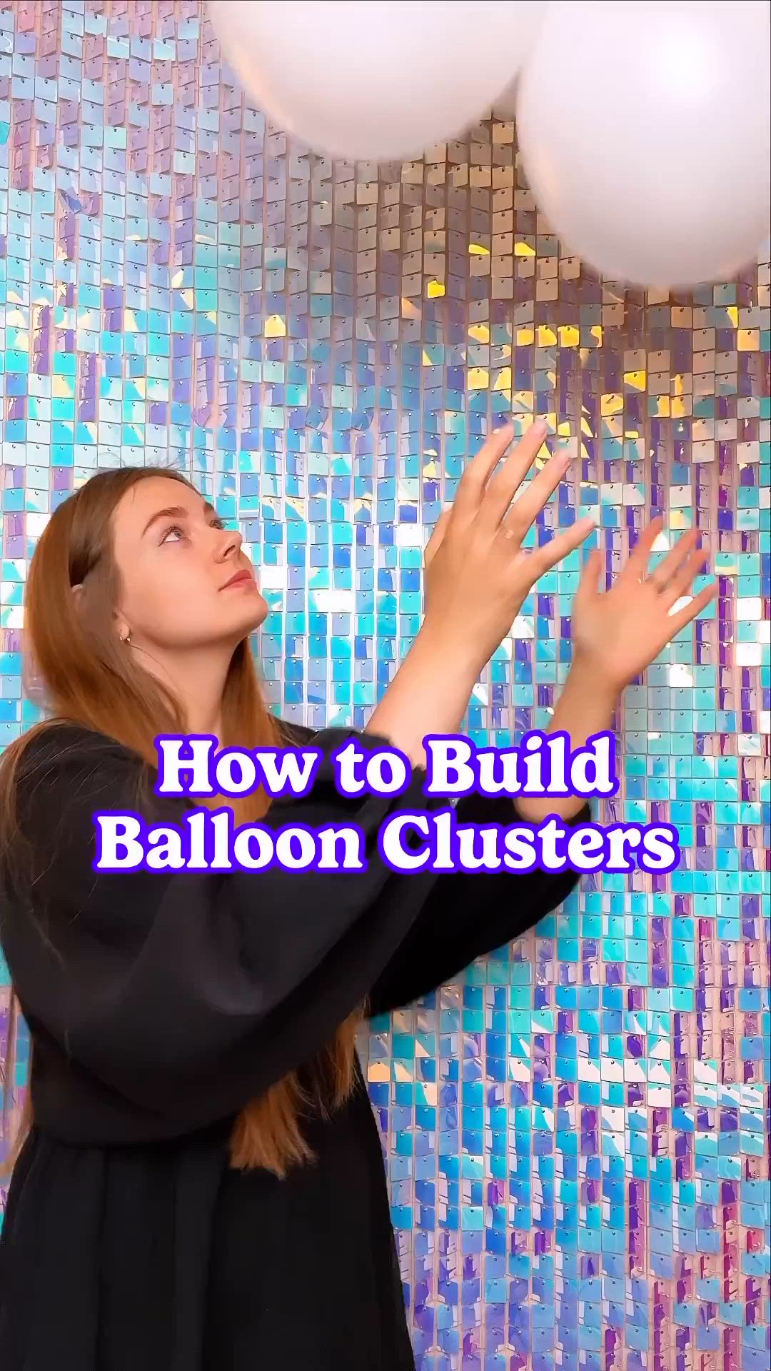 This may contain: a woman holding three white balloons in front of her face with the words how to build balloon clusters