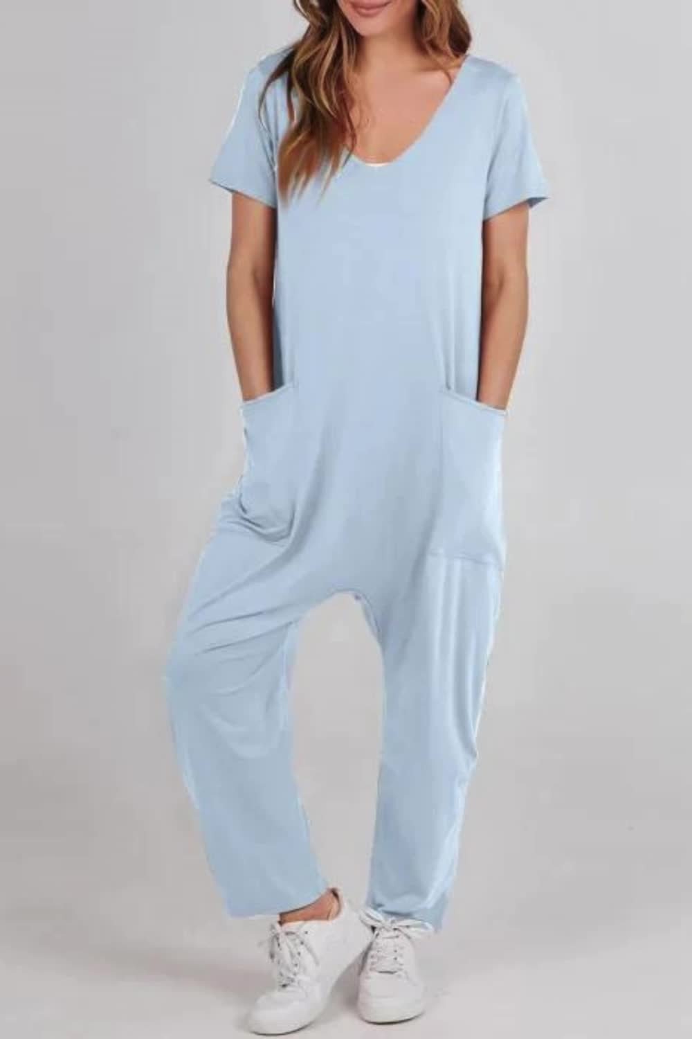 "Experience comfort and style with our Women's Casual Overall Loose Comfy Summer Jumpsuit. Crafted for ease and versatility, this jumpsuit is perfect for everyday wear. Its loose fit and overall design offer both comfort and style, making it a must-have for your summer wardrobe. Embrace laid-back chic with this comfy jumpsuit."