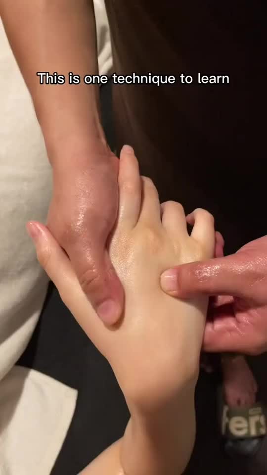 This may contain: a woman getting her foot touched by another person's hand with the caption, this is one technique to learn