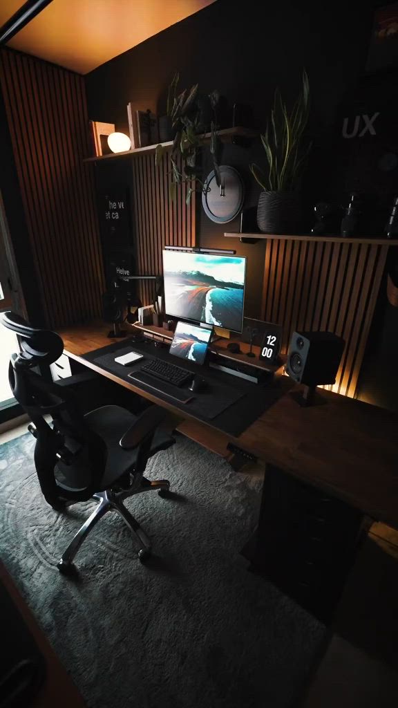 This may contain: a computer desk with a laptop on top of it in front of a large window