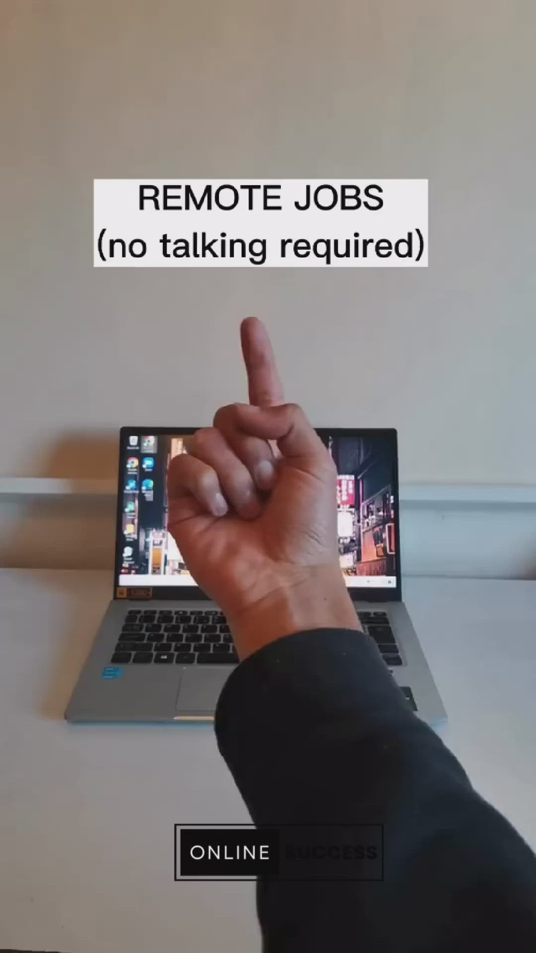 This may contain: a person pointing at a laptop screen with the words remote jobs no talking required