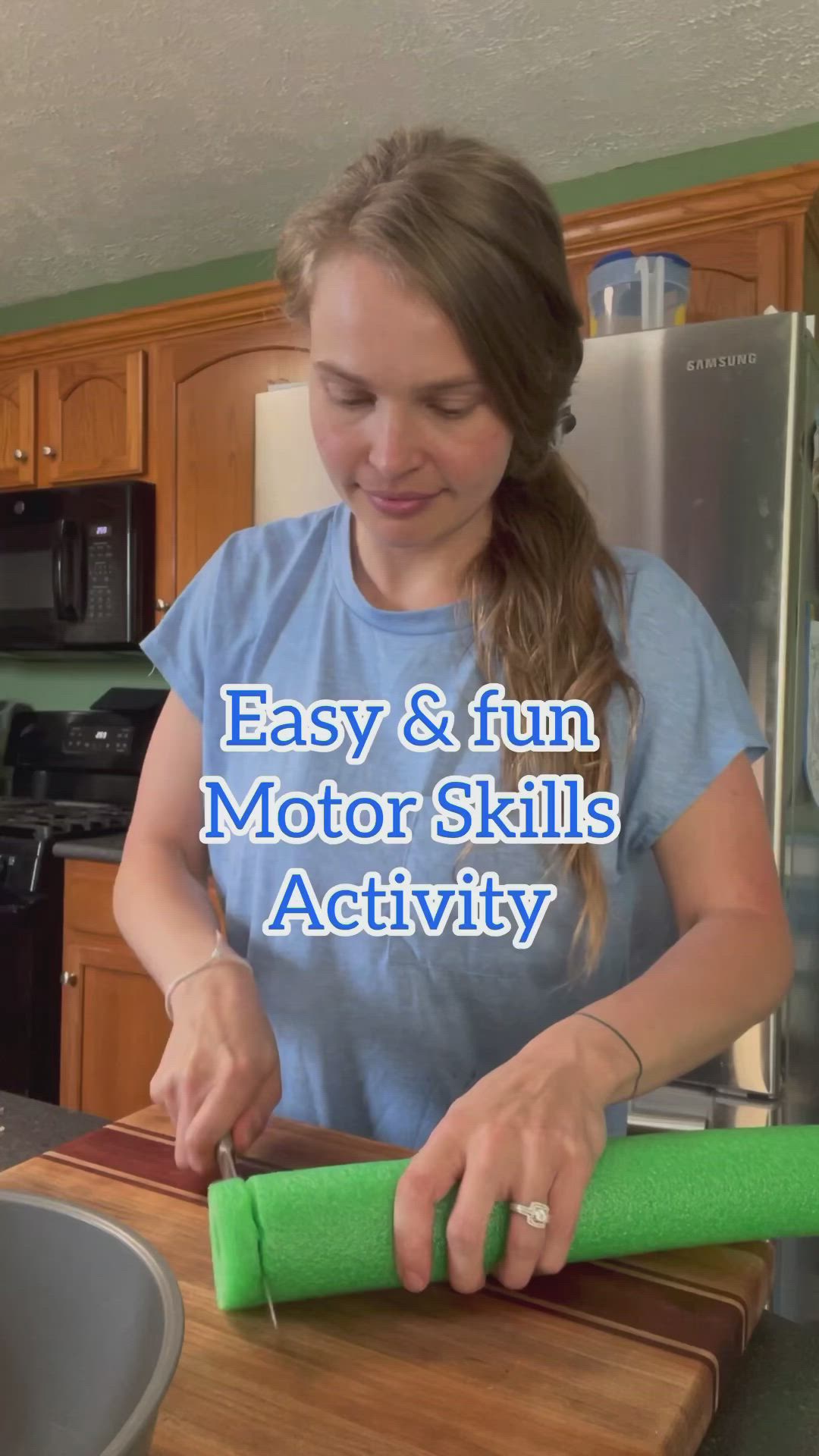 This may contain: a woman is cutting up some food on a wooden board with the words easy & fun motor skills activity quiet blocks