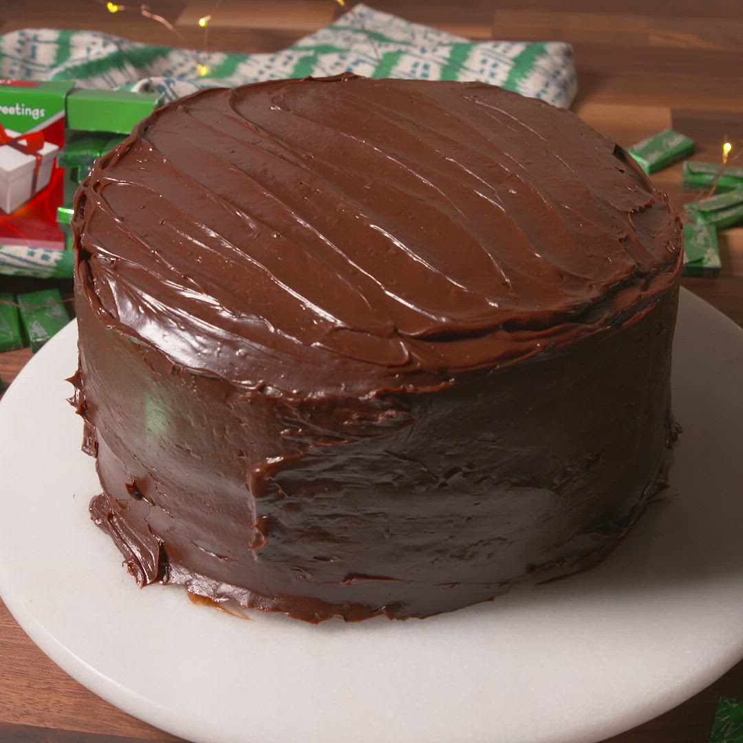 This may contain: a piece of chocolate cake with green frosting