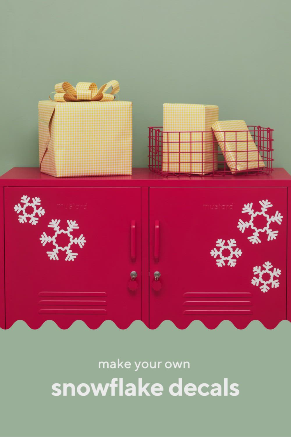 This may contain: a red cabinet with snowflake decals on it and presents sitting on top