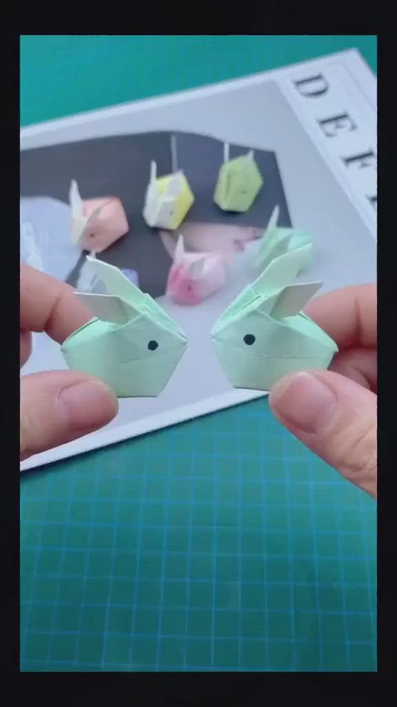 This may contain: someone is holding up some origami animals