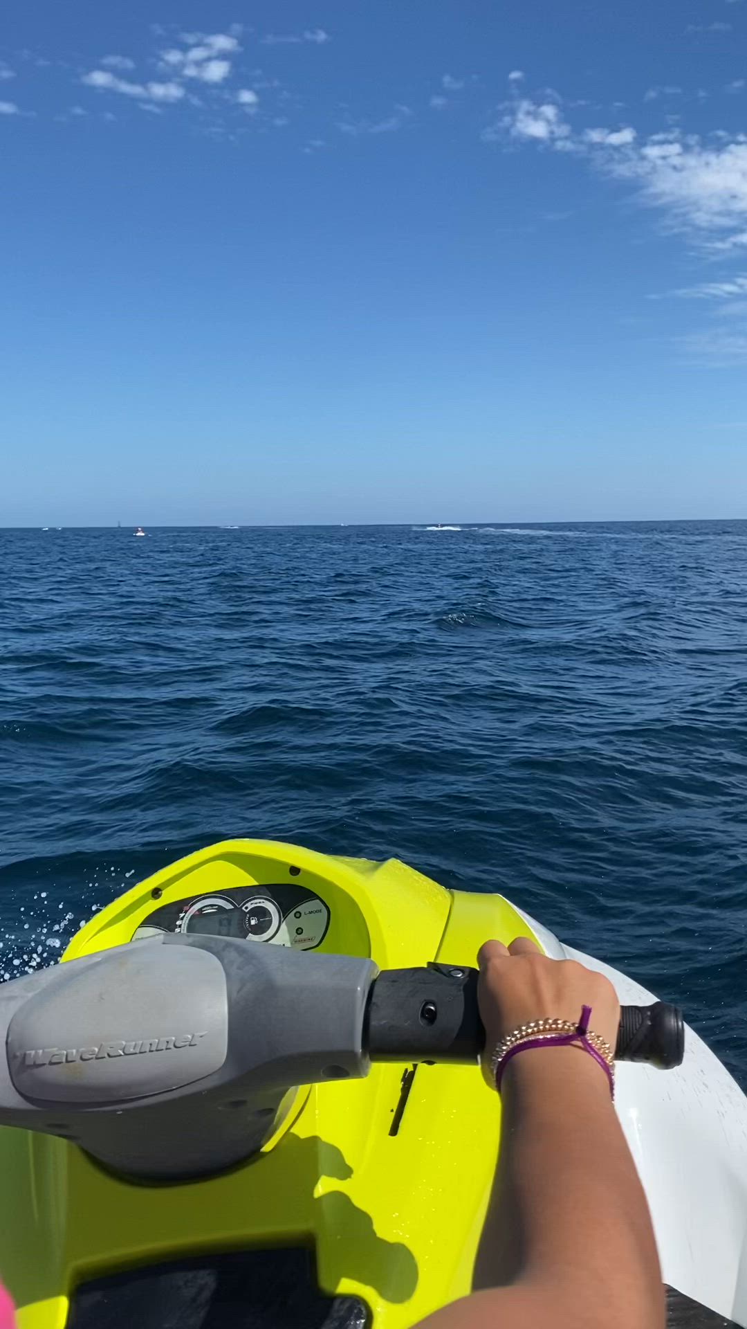 This may contain: a person riding on the back of a yellow boat