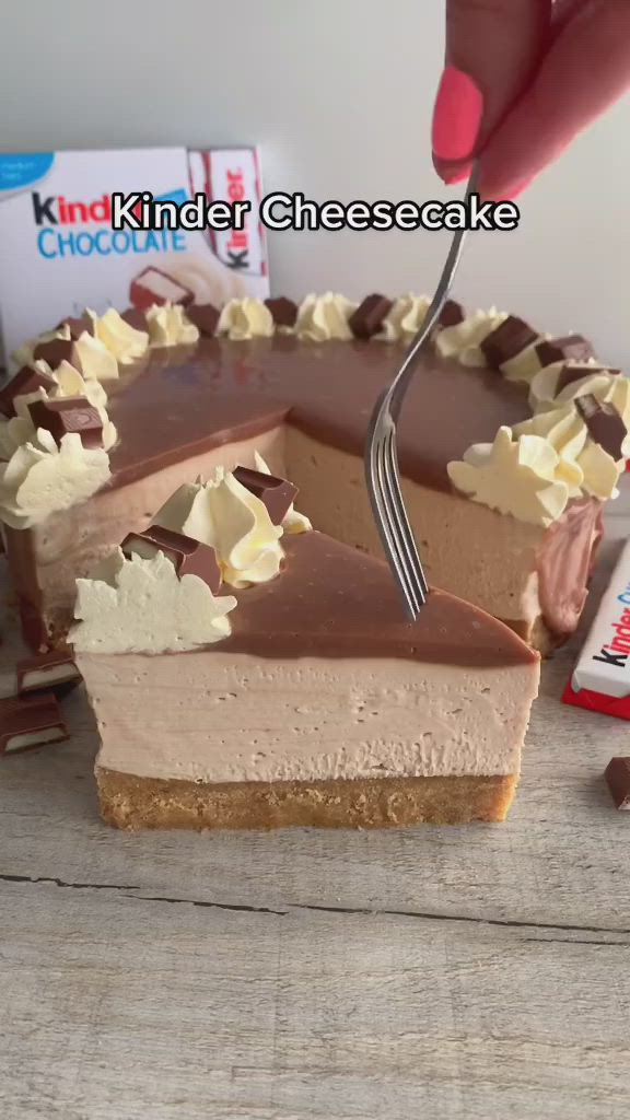 This may contain: someone cutting into a chocolate cheesecake with a knife