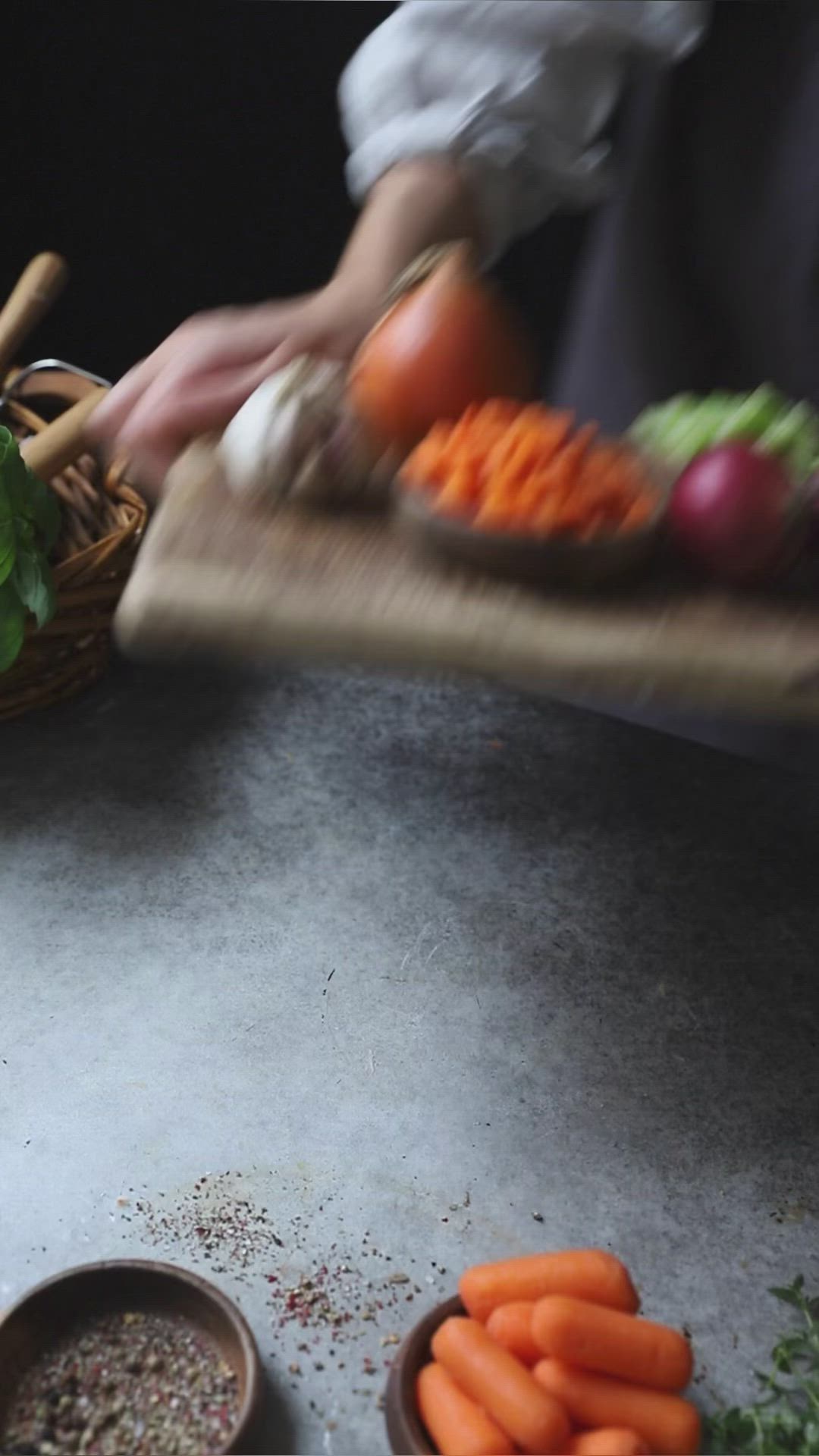 This may contain: two bowls filled with carrots sitting on top of a table next to other vegetables