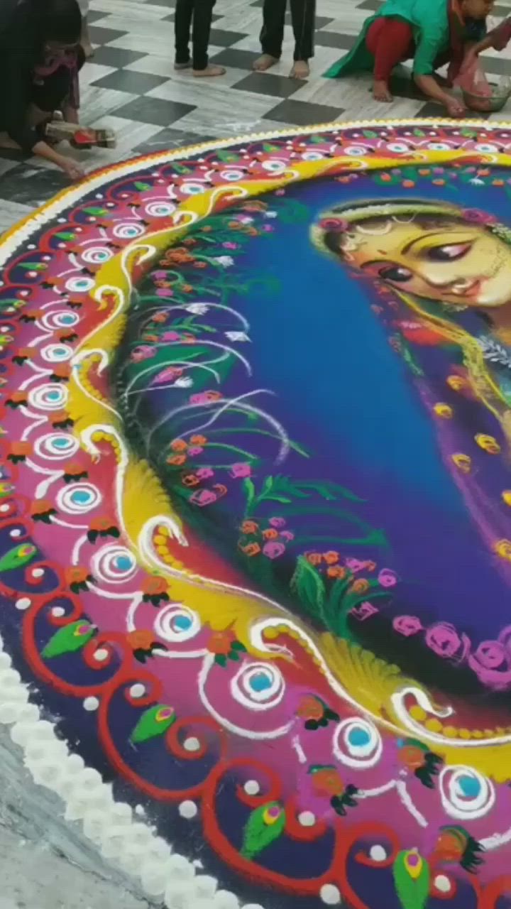 This may contain: people are standing around a large cake with a painting on it