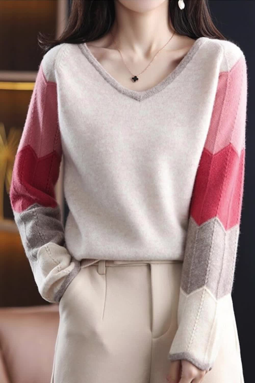 This contains: This fashionable patchwork sweater is perfect for the autumn and winter season. Made of soft and warm knitted fabric, it features a V-neck design and loose fit for ultimate comfort. Stay stylish and cozy with this must-have knitwear top for women.