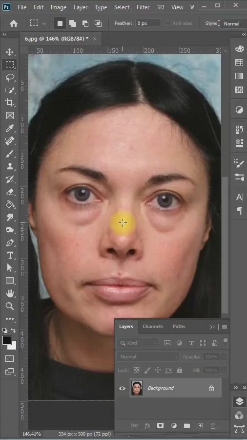 This may contain: a woman's face is shown with an orange spot in the middle of her nose