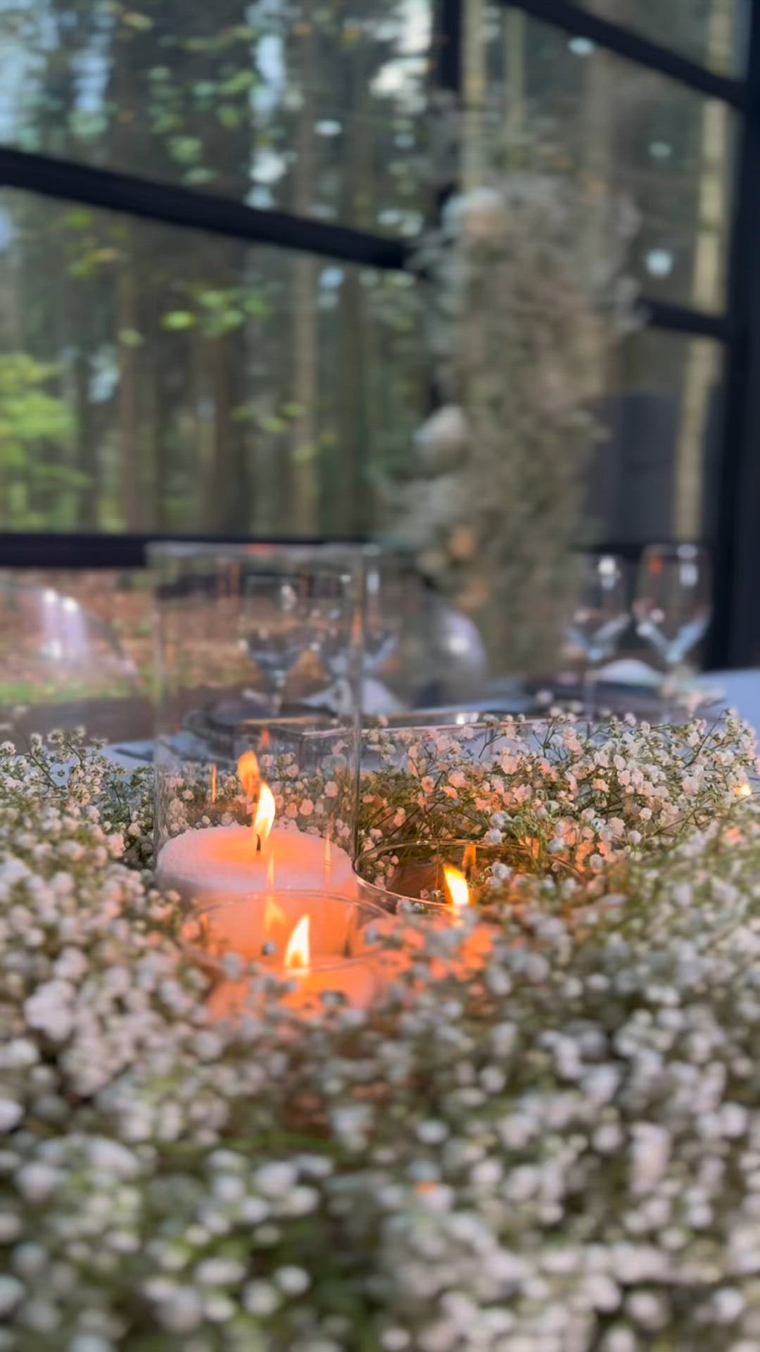 This may contain: the table is set for an event with white linens and place settings, along with silverware