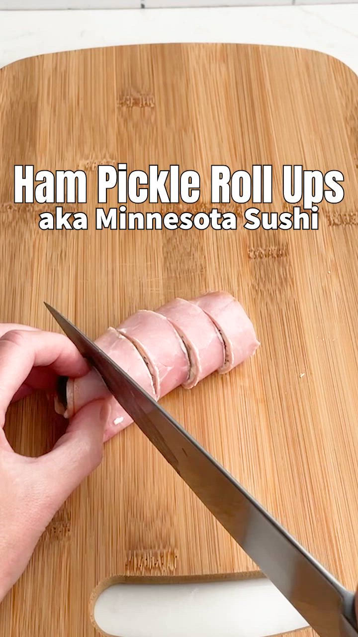 This contains: video demonstrating how to make ham and pickle roll ups with cream cheese.