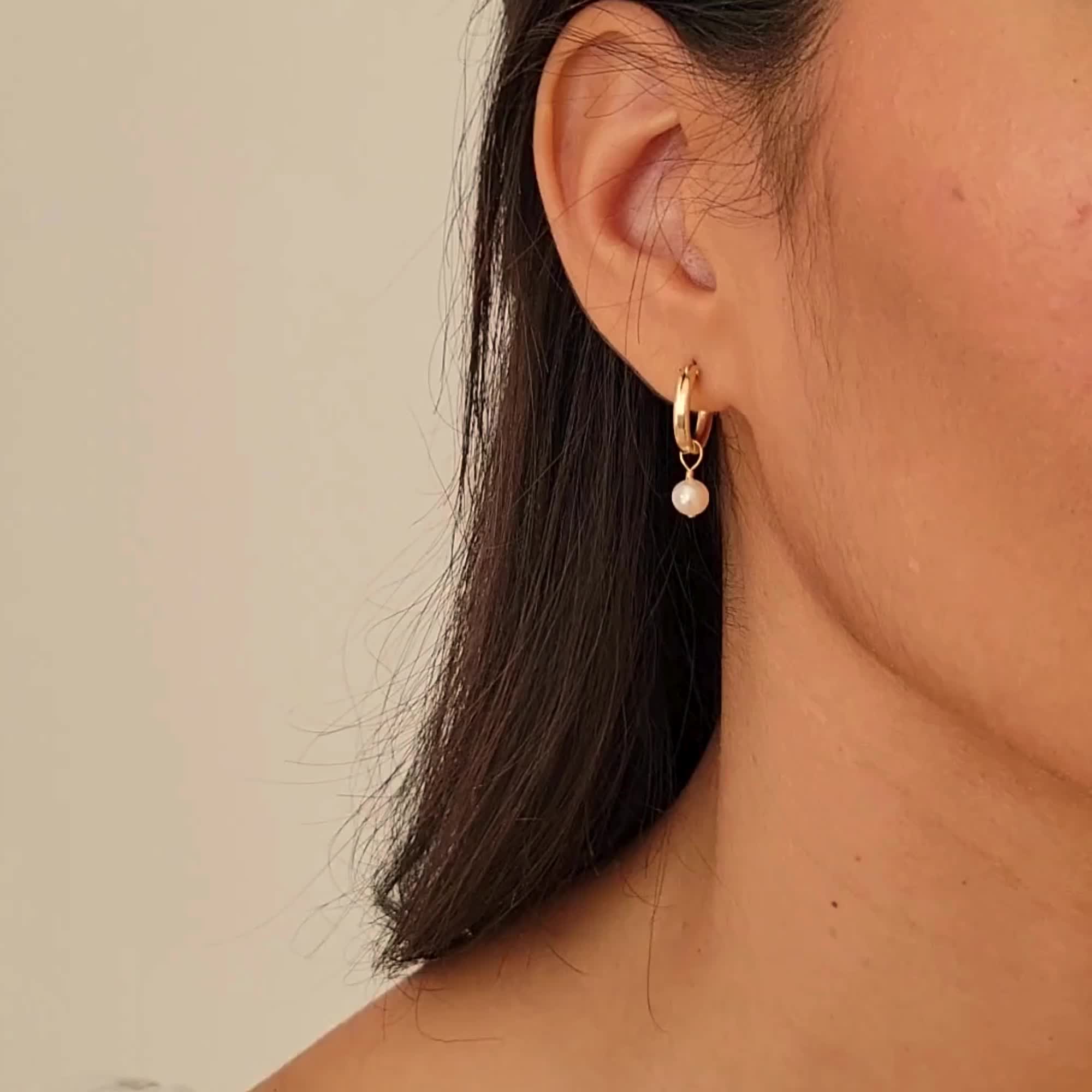 The Pearl Hoop Earrings are endlessly elegant, yet dainty enough to wear every day. A perfect pair of earrings to complete your look and take on your day! You can dress them up or down; whether it's a stroll in the sand or an evening in the city, these luscious hoops are sure to delight. DETAILS 14k gold filled -or- sterling silver 13mm wire & earrings Genuine 6mm freshwater pearls Two-in-one: you can remove the pearls to wear them as plain hoops Comes as a pair Safe for sensitive skin & shower 