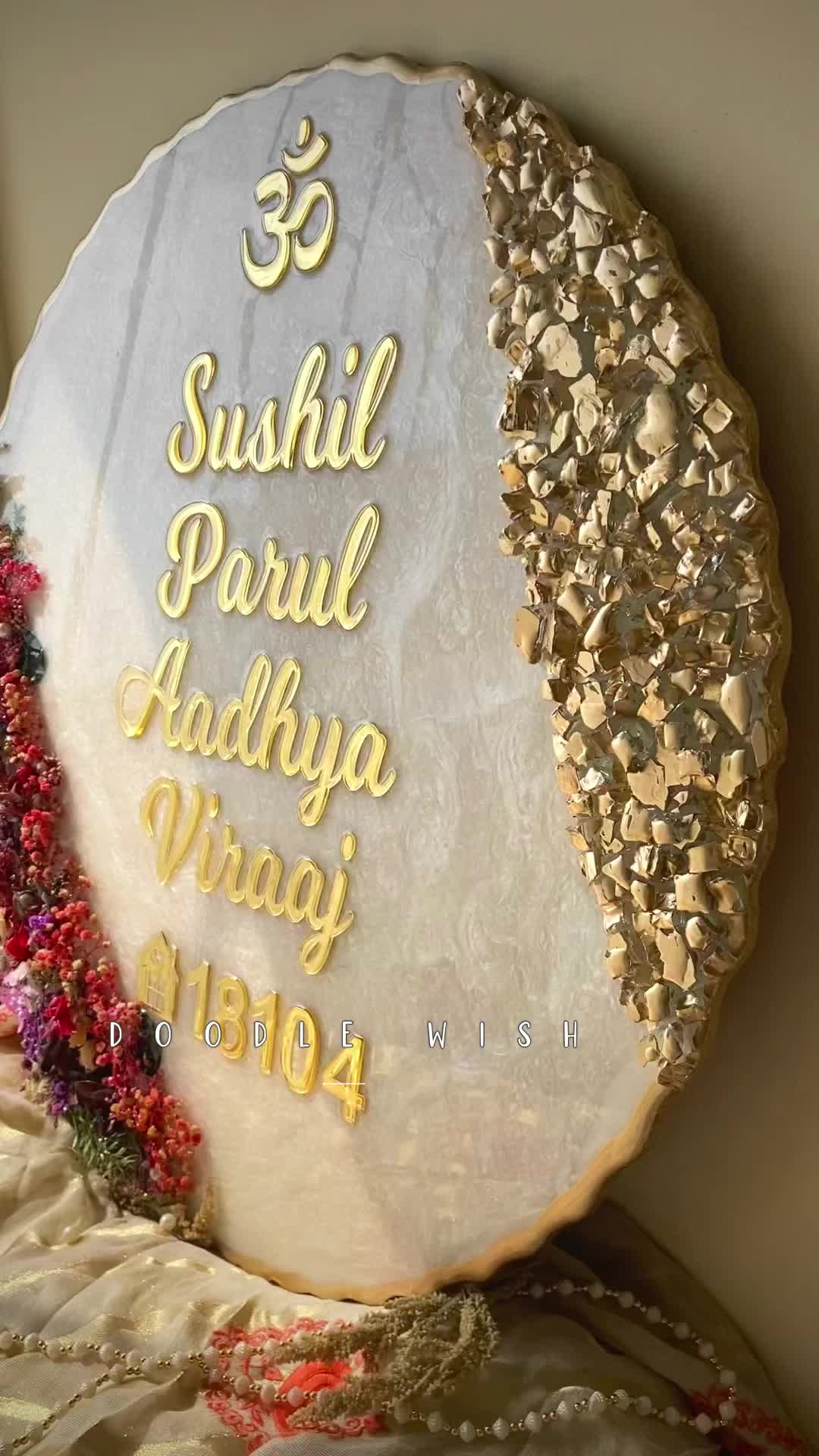 This may contain: a plate with the words sushil parul aadhya waai written on it