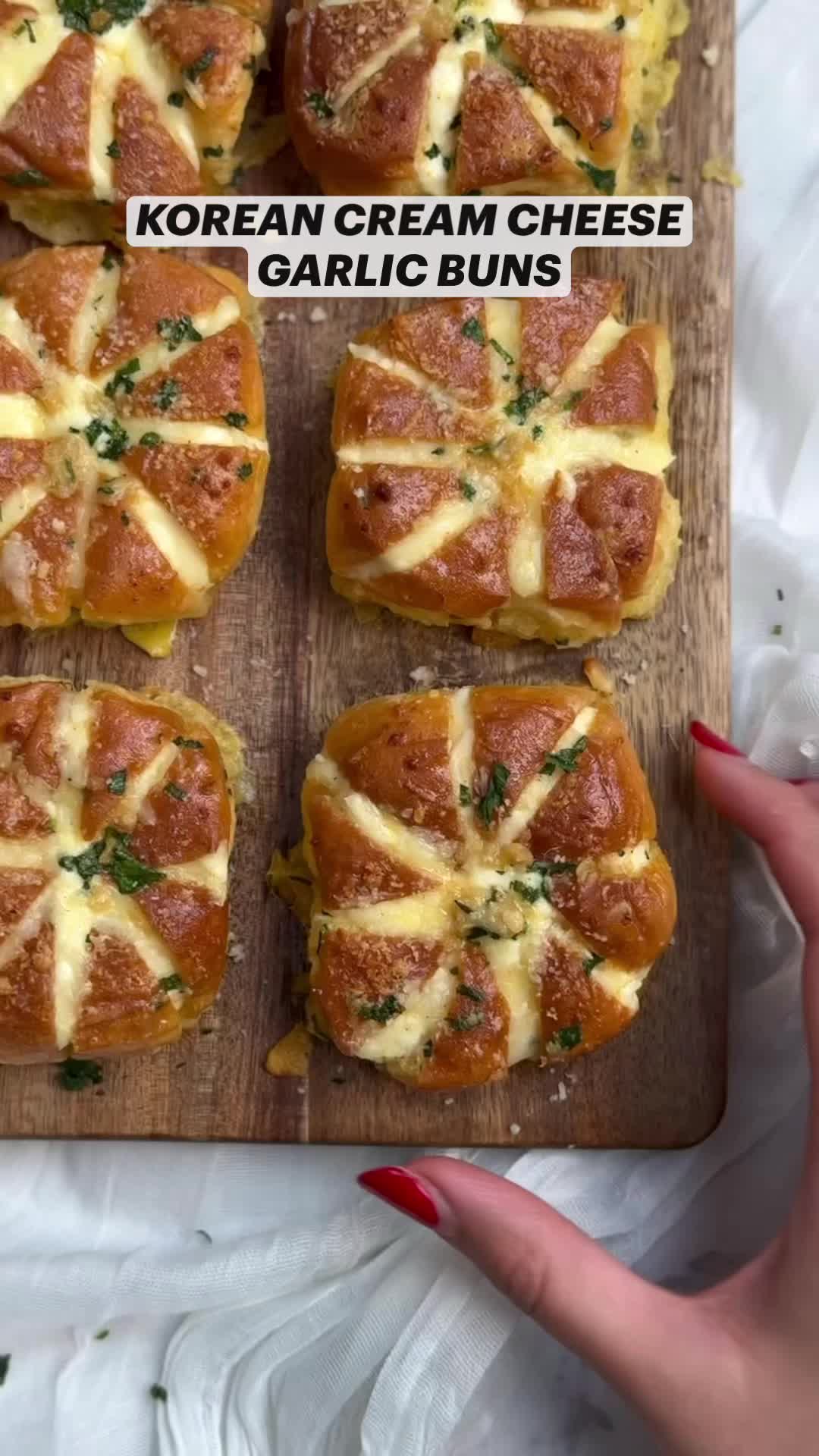 This may contain: four pieces of bread with cheese and herbs on them